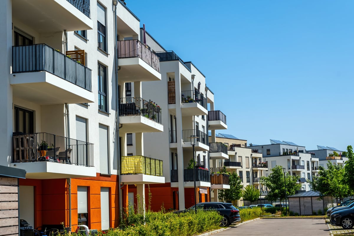 Modern multifamily residential buildings at dusk